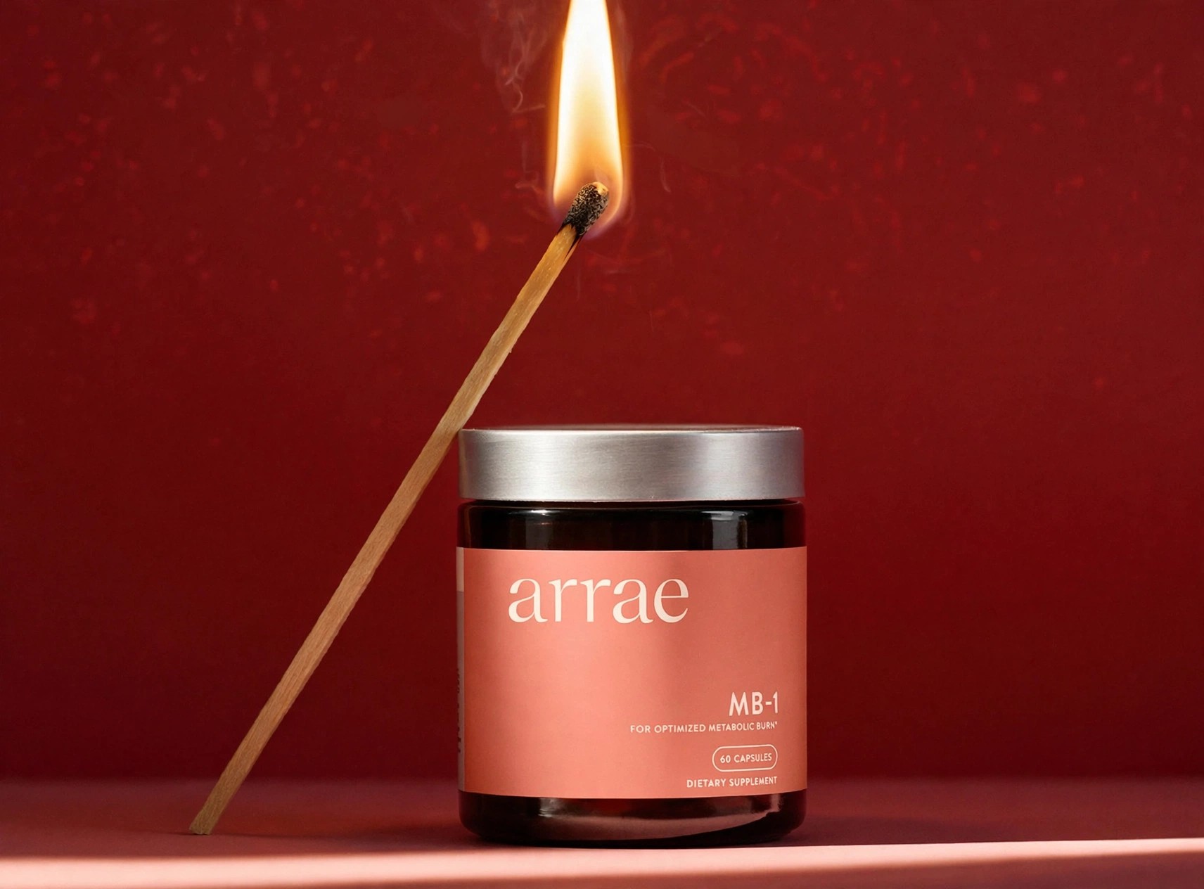 Arrae MB-1 jar with a lit match leaning on it.