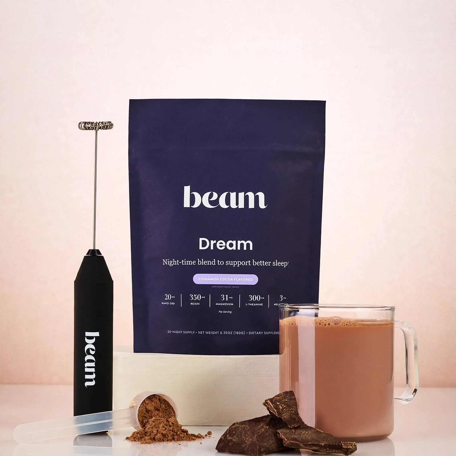 Beam Dream pouch with a mug of hot cocoa and chocolate pieces.