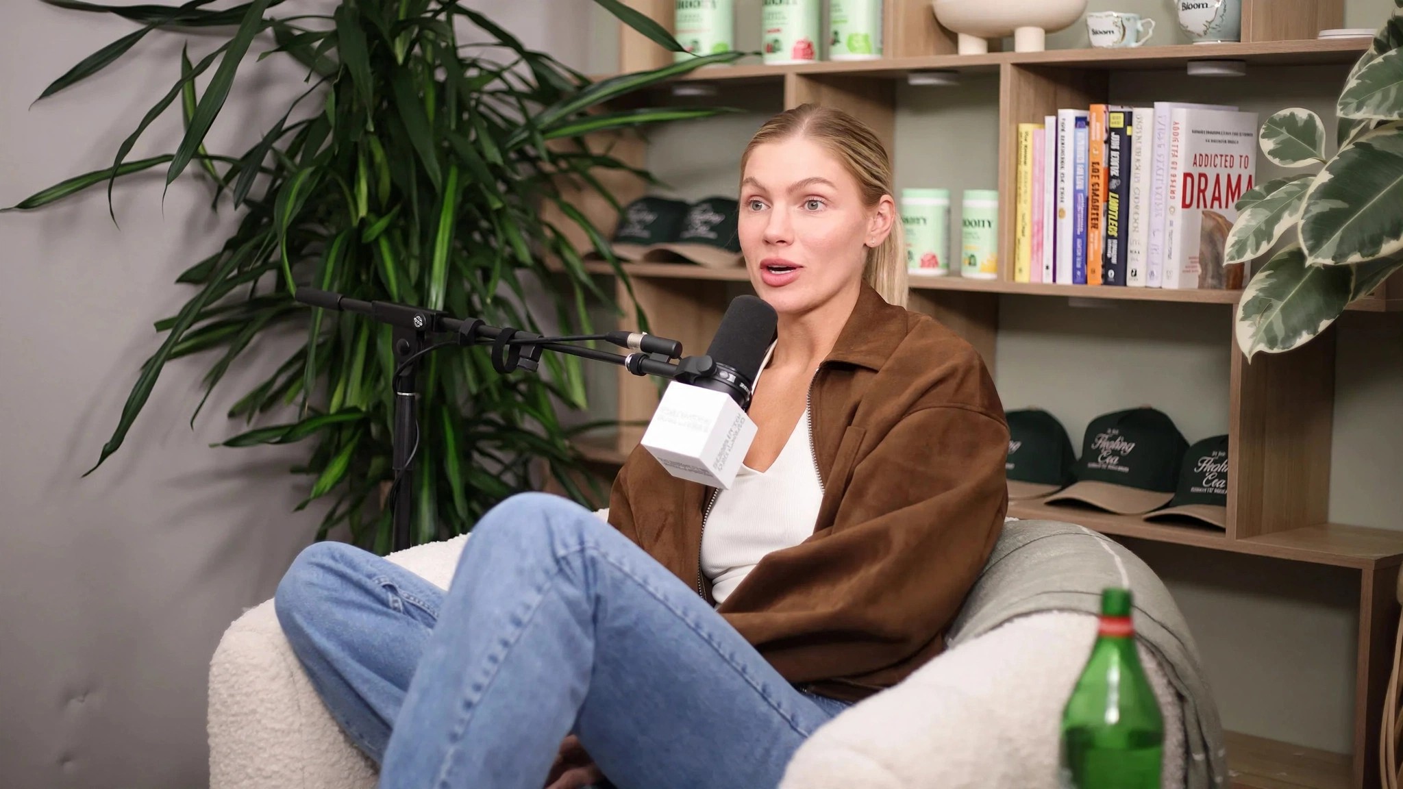 Mari Llewellyn seated in a chair during a podcast interview.